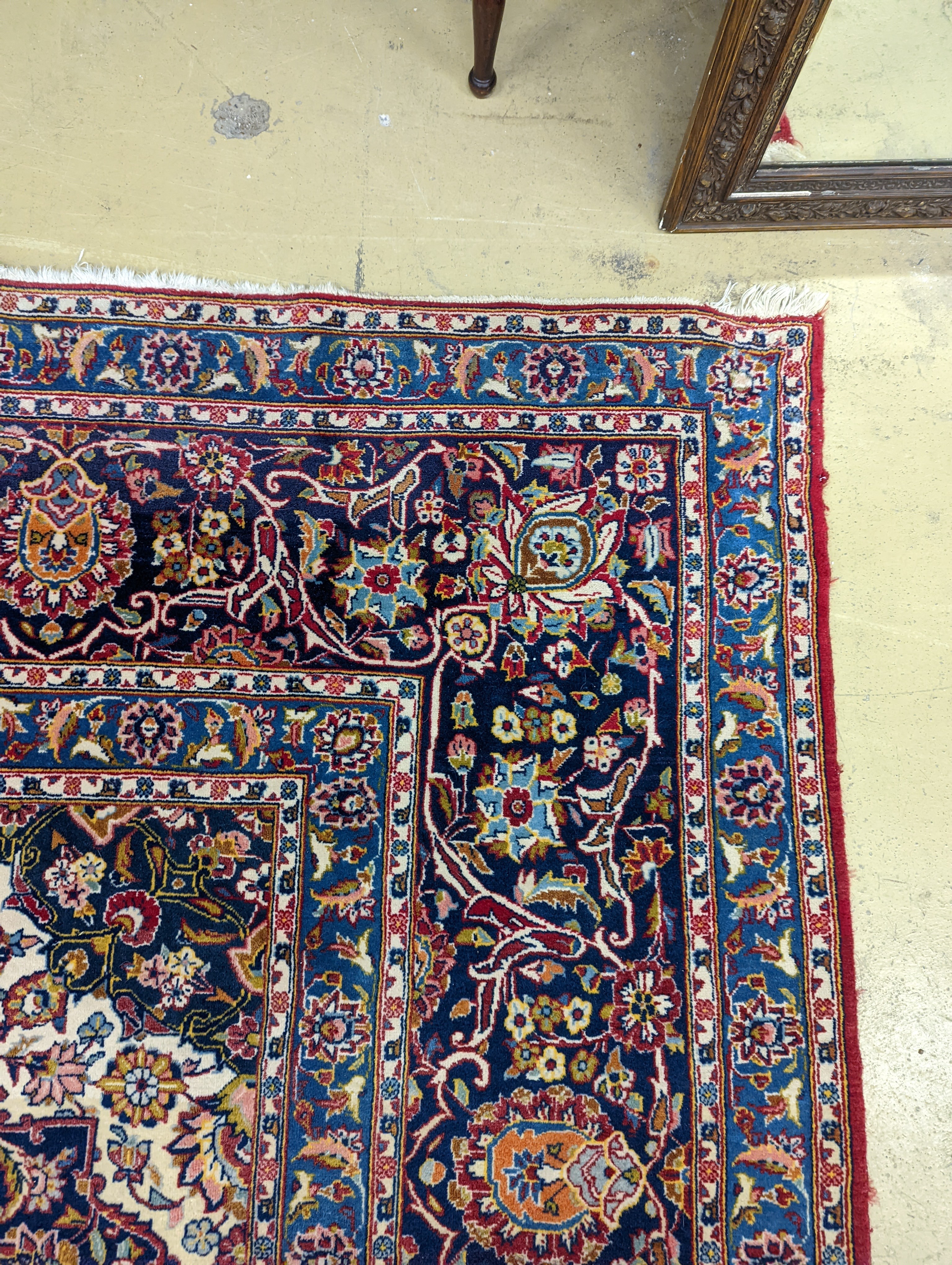 A large Tabriz red ground floral carpet, 540 x 350cm